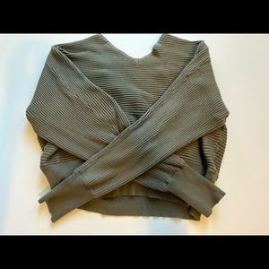 Green sweater with open back